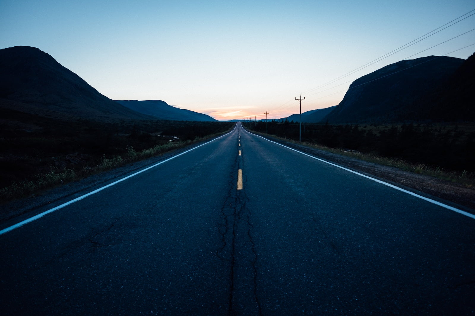 gray concrete road during nighttime