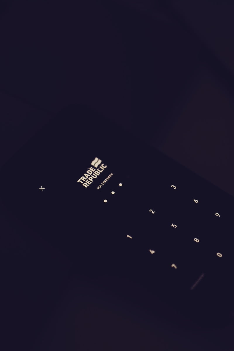 black qwerty phone on black textile